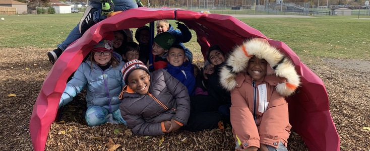 Photo of students out on recess playground.